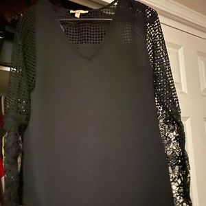 Cute black long sleeve top with open patterned sleeves